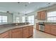 Open kitchen with island countertop overlooks the dining area and features stainless steel appliances at 122 Foxglove Ave, Summerville, SC 29483