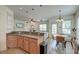 Bright kitchen with countertop seating area, adjacent breakfast nook, and a view into the living room at 122 Foxglove Ave, Summerville, SC 29483