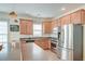 Well-lit kitchen with stainless steel appliances and wooden cabinets at 122 Foxglove Ave, Summerville, SC 29483