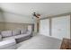 Attic living room featuring a sofa, neutral walls and carpet, and white doors at 122 Foxglove Ave, Summerville, SC 29483
