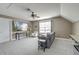 Attic living room featuring a flat screen tv, sofa, chair, and a ceiling fan at 122 Foxglove Ave, Summerville, SC 29483