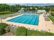 Large community pool with multiple swimming lanes and lounge chairs surrounding the deck at 122 Foxglove Ave, Summerville, SC 29483
