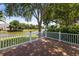 A backyard featuring a large porch overlooking a pond and beautiful trees at 1232 Palmetto Peninsula Dr, Mount Pleasant, SC 29464