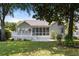 Backyard with a spacious deck, a screened-in porch, and lush green lawn at 1232 Palmetto Peninsula Dr, Mount Pleasant, SC 29464