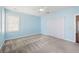 A light blue bedroom with a ceiling fan and windows for natural light at 1232 Palmetto Peninsula Dr, Mount Pleasant, SC 29464