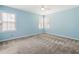 A light blue bedroom with a ceiling fan and windows for natural light at 1232 Palmetto Peninsula Dr, Mount Pleasant, SC 29464