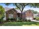 Charming brick home with a well-manicured front yard and mature trees at 1232 Palmetto Peninsula Dr, Mount Pleasant, SC 29464