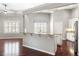Bright eat-in kitchen boasts a granite countertop island, stainless steel appliances and wood floors at 1232 Palmetto Peninsula Dr, Mount Pleasant, SC 29464