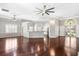 Bright open-concept living area with hardwood floors and seamless kitchen access at 1232 Palmetto Peninsula Dr, Mount Pleasant, SC 29464