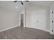 Bright bedroom featuring gray wood floors, white trim, and a vaulted ceiling at 1327 Wood Sorrel Dr, Moncks Corner, SC 29461