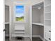 Walk-in closet with built-in shelving and a scenic window view at 1327 Wood Sorrel Dr, Moncks Corner, SC 29461