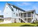 Exterior of the home featuring a screened porch and a stairway to backyard at 1327 Wood Sorrel Dr, Moncks Corner, SC 29461
