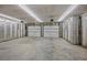Unfinished garage with dual doors, concrete floor, and prepped for insulation at 1327 Wood Sorrel Dr, Moncks Corner, SC 29461
