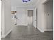 Inviting home hallway showcasing hardwood floors, modern paint colors, and stylish lighting at 1327 Wood Sorrel Dr, Moncks Corner, SC 29461