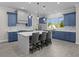 Gourmet kitchen featuring an island with seating and stainless steel appliances overlooking yard at 1327 Wood Sorrel Dr, Moncks Corner, SC 29461