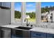 Modern farmhouse sink with a view through a bright window in this gourmet kitchen at 1327 Wood Sorrel Dr, Moncks Corner, SC 29461