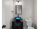Stylish powder room with a unique vessel sink and modern fixtures for guests at 1327 Wood Sorrel Dr, Moncks Corner, SC 29461