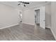 A well lit room with a ceiling fan, gray floors, and two open door ways at 1327 Wood Sorrel Dr, Moncks Corner, SC 29461