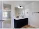 Bathroom featuring dual sinks, black fixtures, a large mirror, and wood-look floors at 137 Ashton Dr, Goose Creek, SC 29445