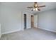 Bedroom features neutral walls, carpet, ceiling fan and a glimpse into the bathroom at 137 Ashton Dr, Goose Creek, SC 29445