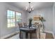 Dining room featuring a chandelier, seating for four, and natural light from the window at 137 Ashton Dr, Goose Creek, SC 29445