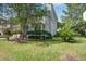Charming two-story home with light gray siding and a manicured front yard in a suburban setting at 137 Ashton Dr, Goose Creek, SC 29445