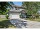 Two-story home with light gray siding, two car garage, and well-maintained landscaping at 137 Ashton Dr, Goose Creek, SC 29445