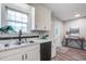 Practical kitchen with white cabinetry, ample counter space, and view of the backdoor at 137 Ashton Dr, Goose Creek, SC 29445