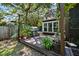 Inviting backyard deck featuring a grill and lush potted plants at 1414 E Crossing Ln, Mount Pleasant, SC 29466