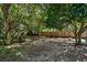 Private backyard featuring shady trees, wooden fence, and a swing, creating a relaxing outdoor oasis at 1414 E Crossing Ln, Mount Pleasant, SC 29466