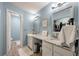 Bathroom features double sinks, granite countertops, and neutral walls at 1414 E Crossing Ln, Mount Pleasant, SC 29466