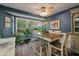 Dining area features a chandelier, neutral paint, an area rug, and large windows for natural light at 1414 E Crossing Ln, Mount Pleasant, SC 29466