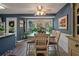 Dining area features a chandelier, neutral paint, an area rug, and large windows for natural light at 1414 E Crossing Ln, Mount Pleasant, SC 29466