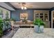 Dining area features a chandelier, neutral paint, an area rug, and large windows for natural light at 1414 E Crossing Ln, Mount Pleasant, SC 29466