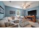 Comfortable living room featuring a large sectional sofa, ceiling fan, and entertainment center at 1414 E Crossing Ln, Mount Pleasant, SC 29466