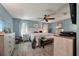 Large main bedroom with neutral walls, ceiling fan, and bright windows, creating a warm and inviting space at 1414 E Crossing Ln, Mount Pleasant, SC 29466