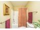 Bathroom featuring shower-tub combo with curtain and coordinating towel racks at 149 Darcy Ave, Goose Creek, SC 29445