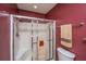Bathroom showcasing tiled walk-in shower with glass door and coordinated towel racks at 149 Darcy Ave, Goose Creek, SC 29445