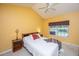 Bright bedroom with a ceiling fan, full bed, a side table, and a window at 149 Darcy Ave, Goose Creek, SC 29445