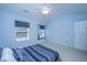Bedroom featuring vaulted ceilings, a ceiling fan, two windows and an adjacent doorway at 149 Darcy Ave, Goose Creek, SC 29445
