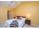 Sunlit bedroom with vaulted ceiling, ceiling fan, and comfortable furnishings and side tables at 149 Darcy Ave, Goose Creek, SC 29445