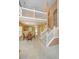 Bright entryway with a staircase and a view to the kitchen and dining area with a round table at 149 Darcy Ave, Goose Creek, SC 29445