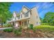 Inviting two-story townhome featuring a well-maintained lawn and an attached garage and charming front entrance at 149 Darcy Ave, Goose Creek, SC 29445