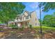 Inviting two-story townhome featuring a well-maintained lawn and an attached garage and charming front entrance at 149 Darcy Ave, Goose Creek, SC 29445