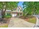 Charming two-story home with a manicured lawn and inviting front entrance, complemented by lush trees at 149 Darcy Ave, Goose Creek, SC 29445