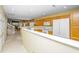 Open kitchen featuring wood cabinets, white appliances, and a breakfast bar overlooking the adjacent living area at 149 Darcy Ave, Goose Creek, SC 29445