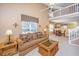 Open-concept living room with sofa, coffee table, overlooking a dining area and a second-floor loft at 149 Darcy Ave, Goose Creek, SC 29445