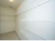 Spacious walk-in closet boasts ample shelving for optimal storage and organization at 149 Darcy Ave, Goose Creek, SC 29445