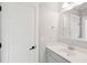 Bright bathroom featuring a vanity with gray cabinets, white countertop, and a decorative mirror at 1510 Old Rosebud Trl, Awendaw, SC 29429