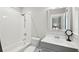 Clean and modern bathroom featuring subway tile surround, contemporary fixtures and a large vanity mirror at 1510 Old Rosebud Trl, Awendaw, SC 29429